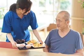 Caregiver preparing meal